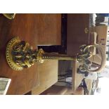 A Victorian cast brass stylised door stop.