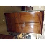 An early 19th century mahogany cupboard on stand, the base containing 2 long drawers and 2 false