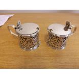 A pair of mid Victorian silver mustard pots (blue glass liners missing), hallmarked London 1838 with