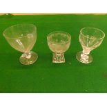 Three antique pedestal glasses, 2 with clear and fluted bowls, the other with etched swag decoration