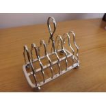 A 6-section toast rack made Sheffield 1934, weighing approximately 4 troy oz.