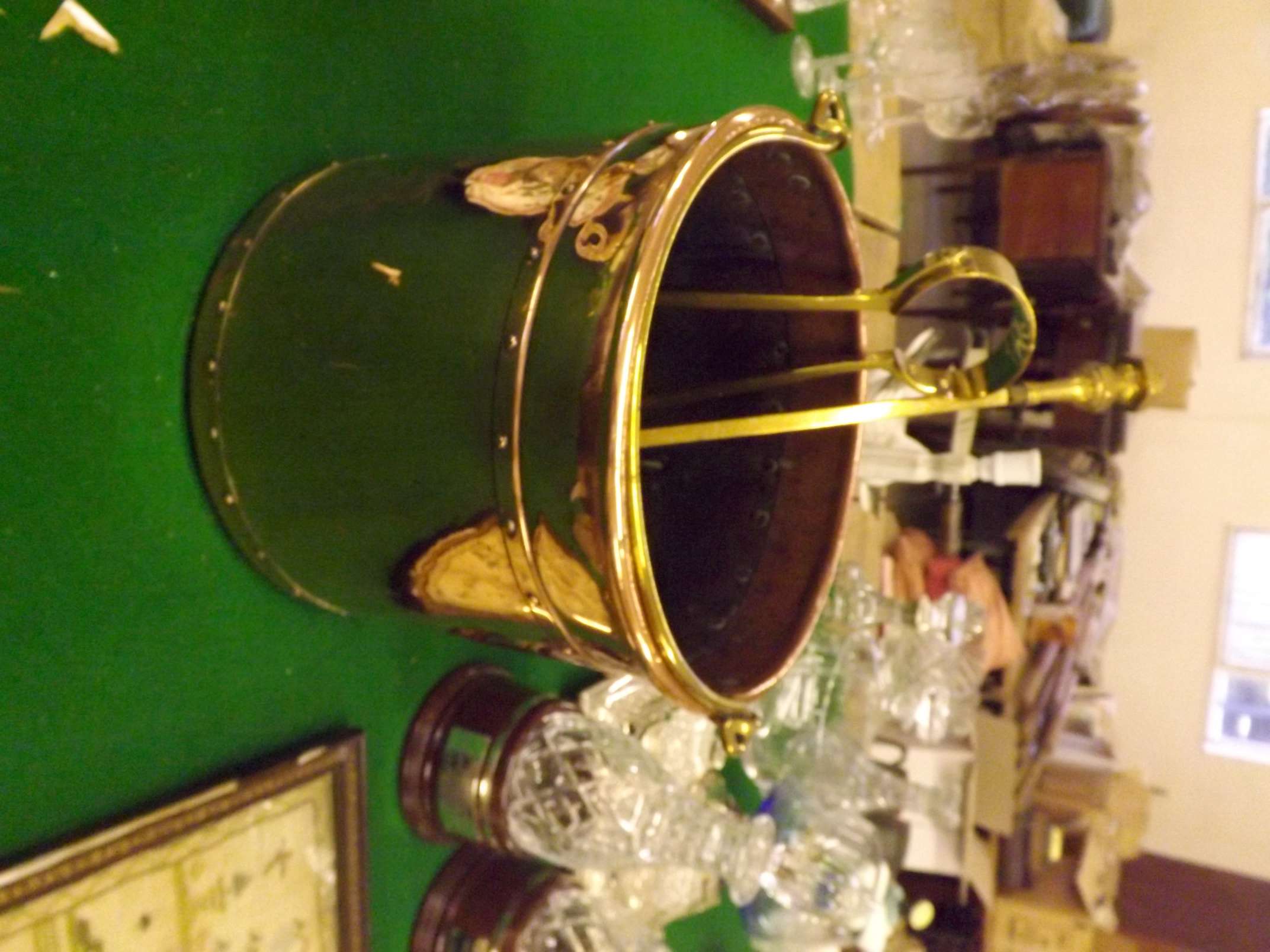 A Victorian copper riveted cylindrical coal bucket with brass handle, brass poker and brass tongs.