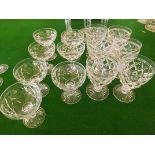 A part set of early 20th century cut glass comprising 6 pedestal wine glasses and 7 open champagne