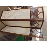 An antique mahogany framed 3-fold screen with cream linen patterned floral panels and inter-twined