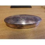 A small oval gentleman's stud dressing table box made in Chester with engine turned decoration.