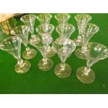 Twelve 18th century style port flutes with cut knopped stems on plain bases.