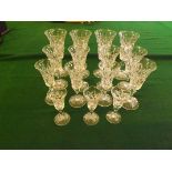 A part set of 20th century Stuart cut glass fluted glasses comprising 4 large wine glasses, 5 medium