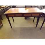 A Victorian side table with 2 drawers on turned legs in mahogany.