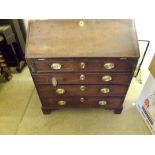 A late 18th century walnut bureau in need of complete restoration, having fall front and 4 long