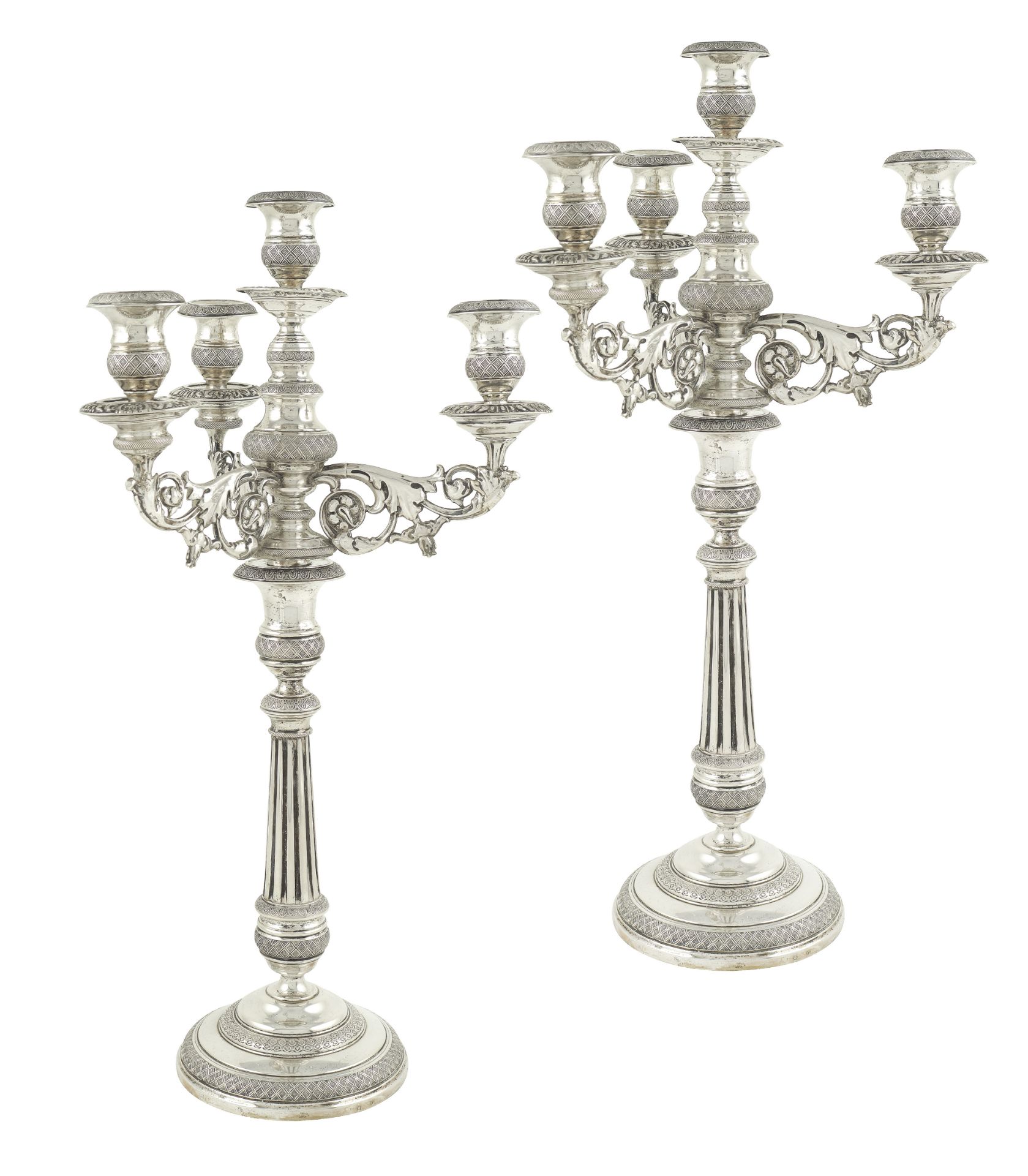 A pair of silver candelabra 4 flames Rome, first half of 19th century peso lordo 1930 gr.