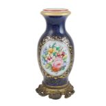 A French porcelain vase France, 20th century h. 39,5 cm.