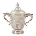 A silver cup with two handles peso 2688 gr.