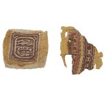 Two Coptic textile fragments Egypt, early Islamic period 641 A.D - 9th century 13x14,5 - 12x15 cm.