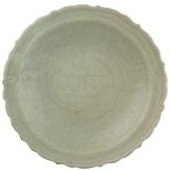 A Celadon ceramic plate China, XVIII Sec. d. 26 cm.