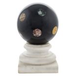 An ornamental sphere in black Belgium marble old manifacture 29x16,5x16,5 cm.