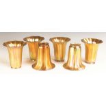 Six Steuben Gold Aurene Shades. Six Steuben Gold Aurene Shades. Early 20th century. Unsigned. Ht.