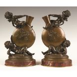 Auguste Moreau (French, 1834-1917) Bronze Cherub Vases with Marble Bases. Auguste Moreau (French,