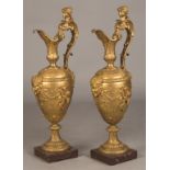 Pair of French Gilt Bronze Ewers, in the Manner of Clodion. Pair of French Gilt Bronze Ewers, in the