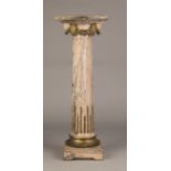 French Pedestal. French Pedestal. 19th century. Pink marble, fluted columns with gilt bronze mounts.