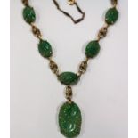 Carved Jade and Gold Necklace. Carved Jade and Gold Necklace. Wearable L 17 1/2"; Pendant: 1 1/4"