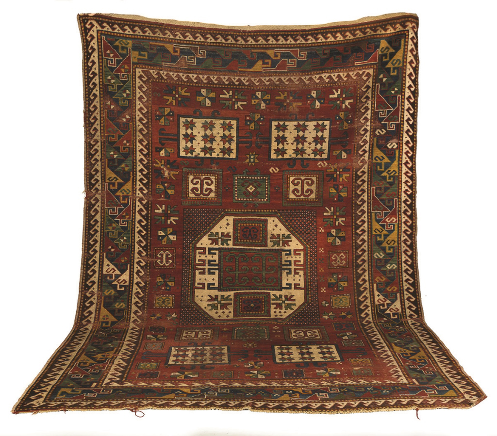 Kazak Rug. Kazak Rug. Circa 1900. 8' 7" x 6'. Areas of wear; approximately 2" x 2" hole; otherwise