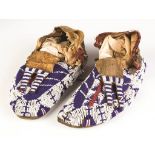 Pair of Sioux Moccasins. Pair of Sioux Moccasins. Late 19th century. L 10 1/2". Some loss to beads.