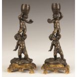 French Bronze and Gilt Bronze Putti Candlesticks. French Bronze and Gilt Bronze Putti