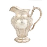 Gorham Sterling Silver Cast Water Pitcher.Circa 1890's. Repoussé flowers. 33 ozt. Ht. 10 1/2" W 9