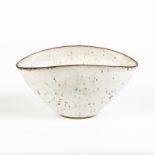 Lucie Rie (English, 1902-1995) Oval White Bowl with Dark Rim and Translucent Spots.Signed.No repairs