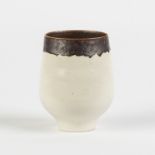 Lucie Rie (English, 1902-1995) Cup.Signed. Porcelain, white glaze with manganese rim.No repairs or