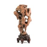 Gong-Shi (Scholar Stone).Red porous river stone with base. Ht. on Stand 16 1/2" W 6 1/2".