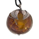 Large Silver Mounted Amber Pendant .Ht. 3" .Online bidding available: https://live.cottoneauctions.