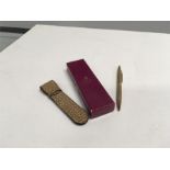A 9ct gold pen and leather pouch together with an Aspreys box.