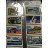 A blue album of cigarette cards including Players theatrical, topographical ,planes horses.