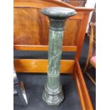 A green marble column.