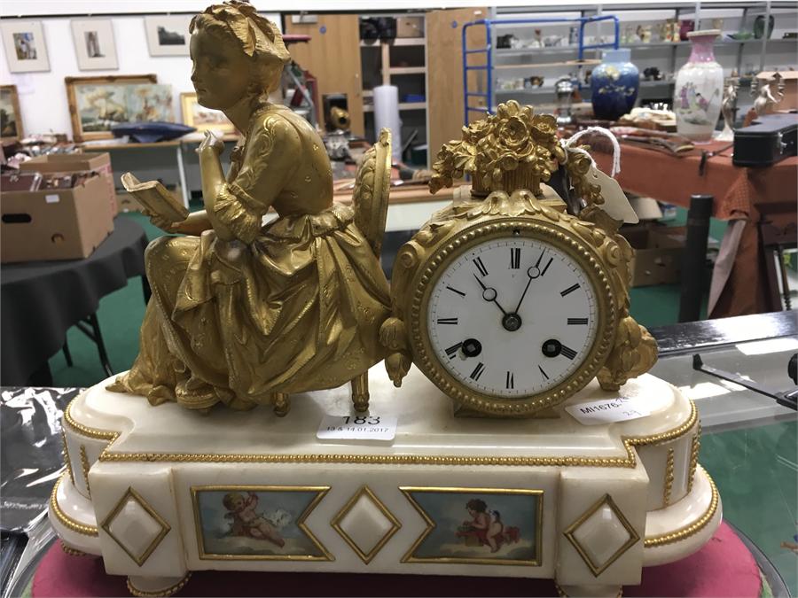 A 19th century Ormolu French mantle clock with alabaster base, with hand painted Sevres style panels