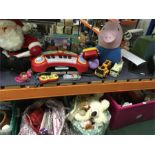 A collection of children's toys to include cuddly Father Christmas George pig vehicles and