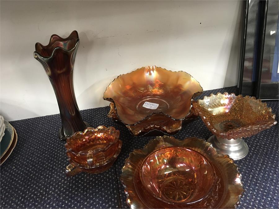 A collection of various Carnival glass items.