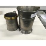 A pewter quart mug inscribed Ditton Marsh and an Imperial brass mounted smaller.