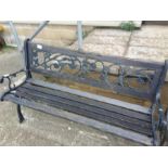 A cast iron garden bench .