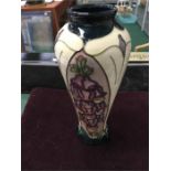 A Moorcroft Foxglove vase 8 inch. design R Bishop paint M Thomas.