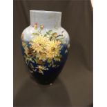 A large Victorian blue glazed vase decorated lmpasto flowers signed J Winek.