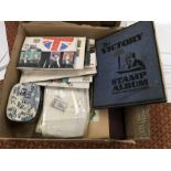 Various stamp albums and first day covers including tin of loose stamps.