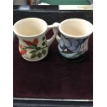 A Moorcroft Rose hip mug for Libertys 1991 and Mcc mug 1992.