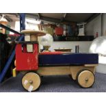 A child's wooden sit on vehicle.