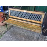 A cast aluminium lattice backed garden bench.