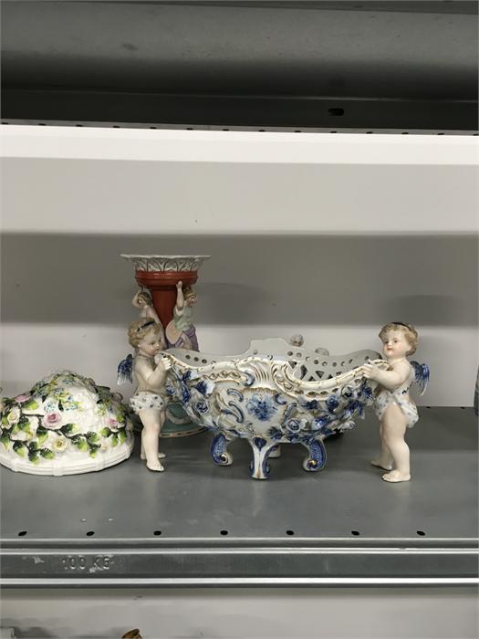 Three 19th century Dresden style china figurines together with a late 19th century china fairing