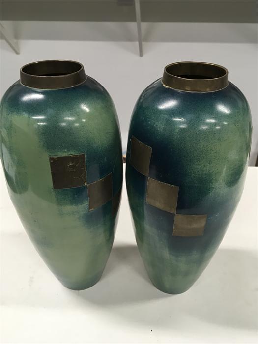 A pair of 20th century WMF style bronze ovoid shaped vases, decorated in tones of blue and green.