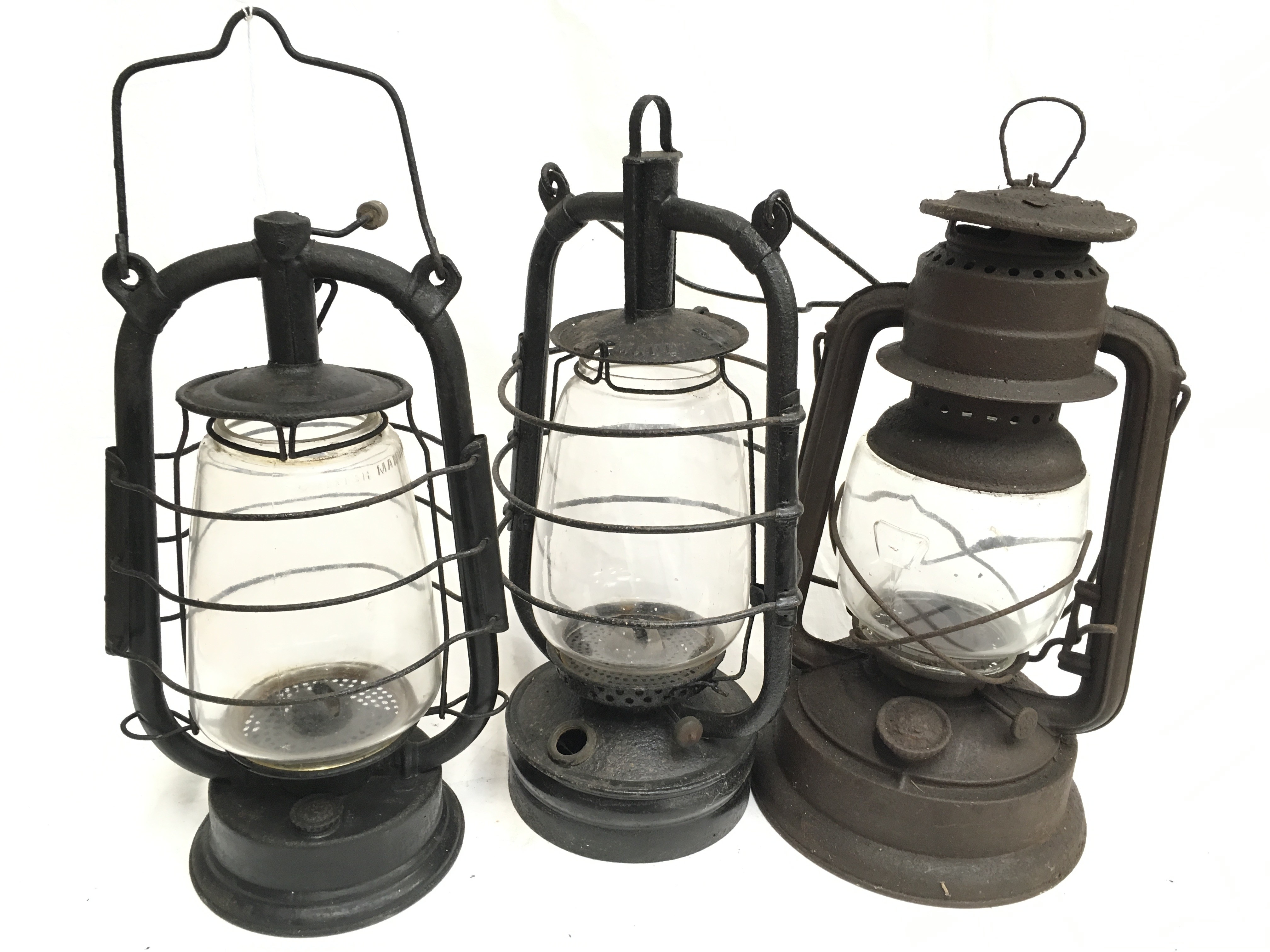 Two German storm lanterns: Feurhand No.280, height 36cm; Frowo No.120, height 34cm. Together with