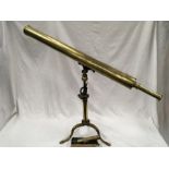 A large brass telescope on stand.